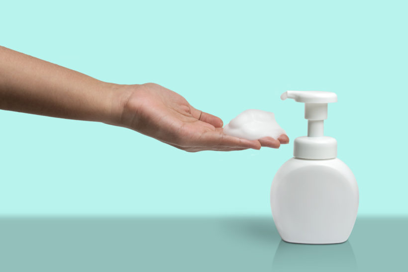 Woman,Hand,Take,Some,Cleaner,Foam,From,Pure,White,Plastic